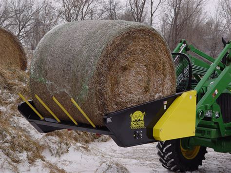 loading round bales with skid steer|roto king.